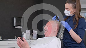 An elderly man visits a trichologist. Hair loss problem