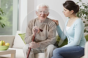 Elderly man with walking stick