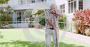 Elderly, man and walking stick or dancing outdoor for fun in retirement for comedy happiness, weekend or garden. Old