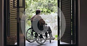 Elderly man, wheelchair and back with thinking, memory or vision of life, decision or choice by door. Depression, mental