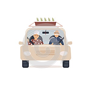 Elderly man and woman sit in front seat of car and look through windshield.Front view. Nice married couple of pensioners go to