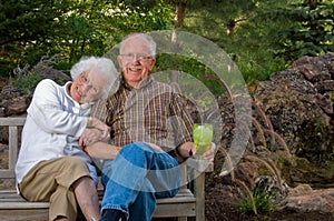 Elderly man and woman sitting on