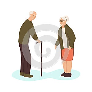 An elderly man and a woman are standing opposite each other on the street