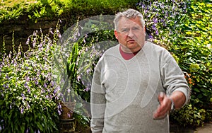 Elderly man working in the garden