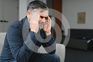 Elderly men with headache indoor
