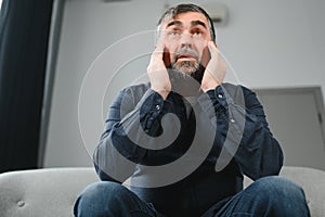 Elderly men with headache indoor