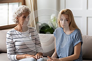 Elderly mom grownup daughter feeling dissatisfaction after dispute