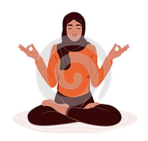 Elderly muslim woman with closed eyes meditating in yoga lotus posture. Stress Awareness Month. The concept of zen and