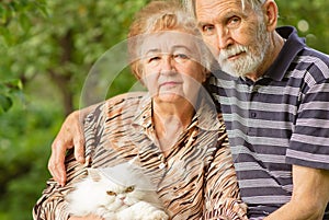 Elderly pair with Persian cat