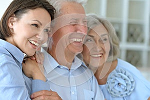 Elderly parents and their adult daughter