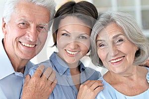 Elderly parents and their adult daughter