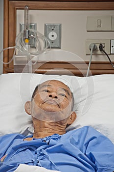 Elderly patien in hospital lay on the bed