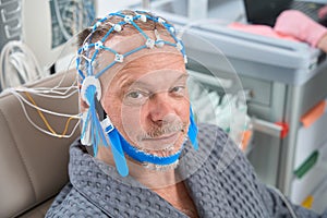 Elderly patient on the diagnostic EEG encephalography procedure