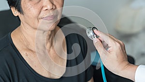 Elderly patient heart health check by medical geriatric doctor for awareness in stroke systolic high blood pressure, hypertension photo