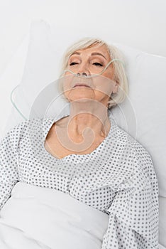 Elderly patient with nasal cannula lying