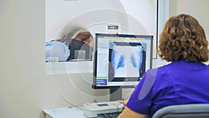 Elderly patient is scanned by MRI, CT scanner at modern hospital.