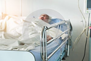 Elderly patient sleep on the bed in hospital ward room