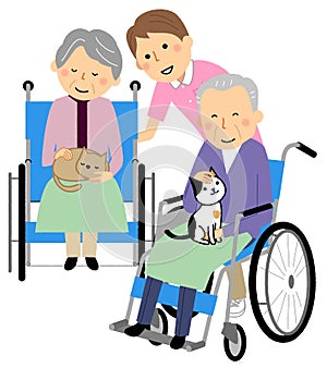 Elderly people and caregivers receiving animal therapy