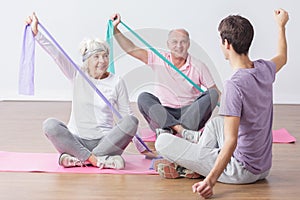 Elderly people do physical exercises