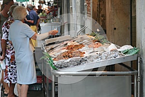 Elderly people at the fish market