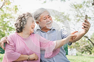 Elderly people lifestyles and communication technology. Happy grandparent using tablet video call and talking with family.