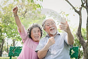 Elderly people lifestyles and communication technology. Happy grandparent using tablet video call and talking with family.