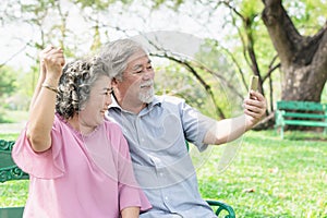 Elderly people lifestyles and communication technology. Happy grandparent using tablet video call and talking with family.