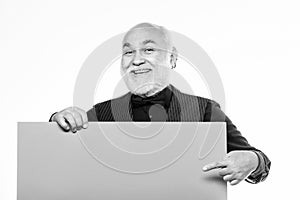Elderly people. Man bold head and gray beard hold poster for advertisement copy space. Senior means experienced. Senior