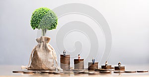 Elderly people sitting on coins stack.