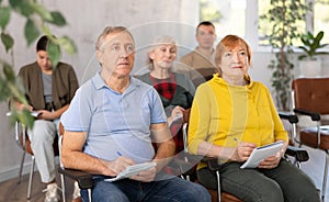 Elderly people study in classroom on refresher courses