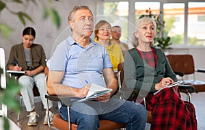 Elderly people study in classroom on refresher courses