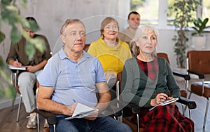 Elderly people study in classroom on refresher courses