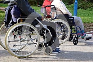 Elderly people in wheelchairs