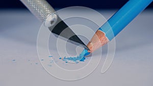 Elderly Person Sharpen a Colored Pencil Using a Sharp Little Knife