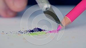 Elderly Person Sharpen a Colored Pencil Using a Sharp Little Knife