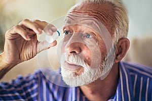 Elderly Person Using Eye Drops