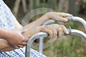 Elderly physical therapy by caregiver in backyard