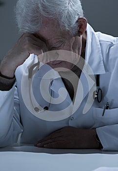Elderly practitioner having sinus pain