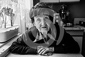 An elderly russian retired woman. Black and white photo.