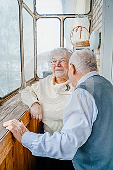 Elderly senior romantic love couple. Old retired man woman together. Aged husband wife in cozy home sweater.Elder