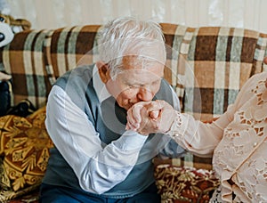 Elderly senior romantic love couple. Old retired man woman together. Aged husband wife in cozy home sweater.Elder