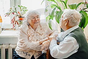 Elderly senior romantic love couple. Old retired man woman together. Aged husband wife in cozy home sweater.Elder