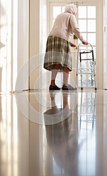 Elderly Senior Woman Using Walking Frame