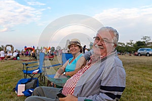 Elderly Spectators Sitting In Deckchairs photo