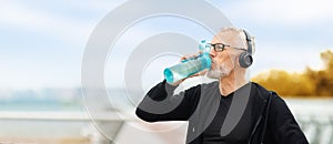 Elderly sportsman drinking water, have outdoor workout, copy space