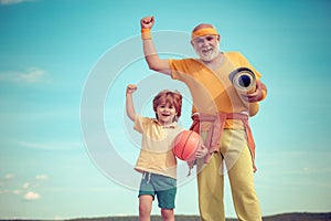 Elderly sporty man and young boy sporting morning workout - copy space. Young - old workout. Portrait of a healthy