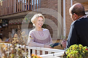 Elderly spouses in patio