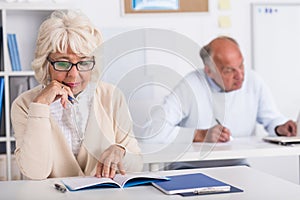 Elderly students working in class