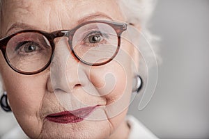 Elderly stylish female thinking about life