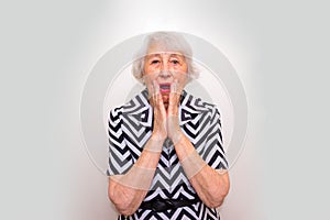 Elderly surprised woman